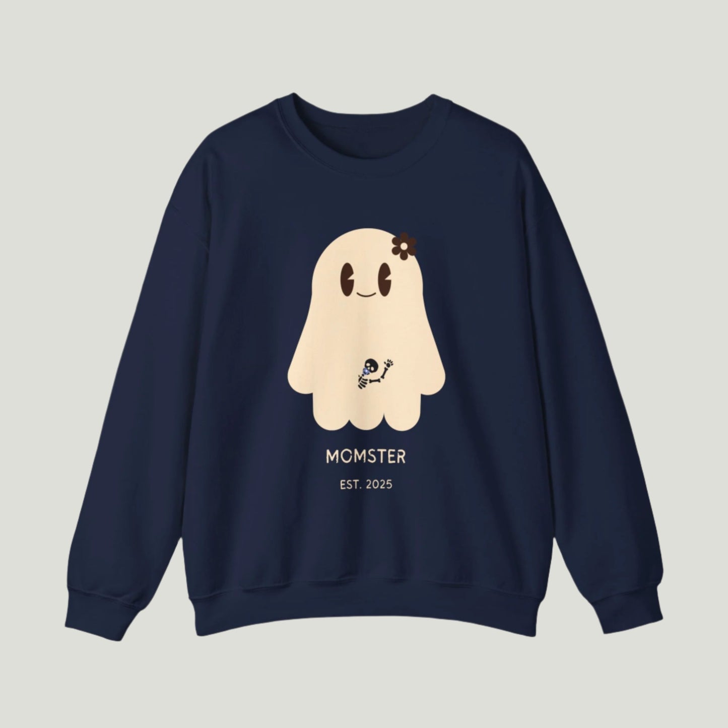 Cute Ghost Momster Sweatshirt in blue navy color featuring an adorable illustration of a ghost with a skeleton holding a pacifier, waving from the belly. The design includes the text “Momster. Established 2025,” making it an ideal choice for announcing a pregnancy during Halloween celebrations. Perfect for a fun and festive reveal!