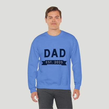 Carolina Blue Dad Established 2025 Sweatshirt, perfect for announcing a pregnancy to dads-to-be. The design features bold text celebrating the exciting new role of fatherhood, making it a great gift for expectant dads.