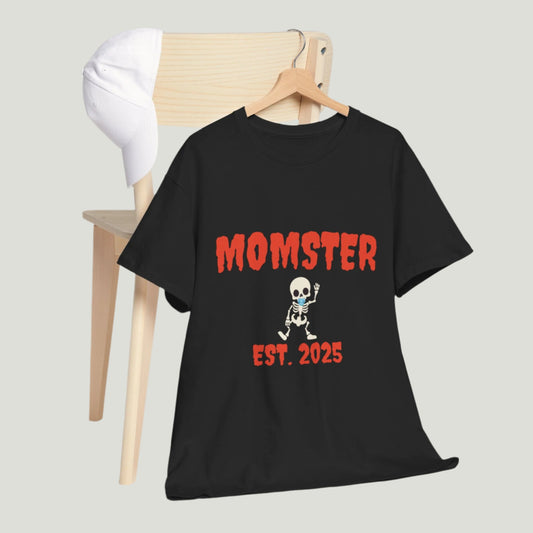 Black t-shirt featuring red text "Momster Est. 2025," perfect for announcing a pregnancy during Halloween, showcasing a playful and festive design.