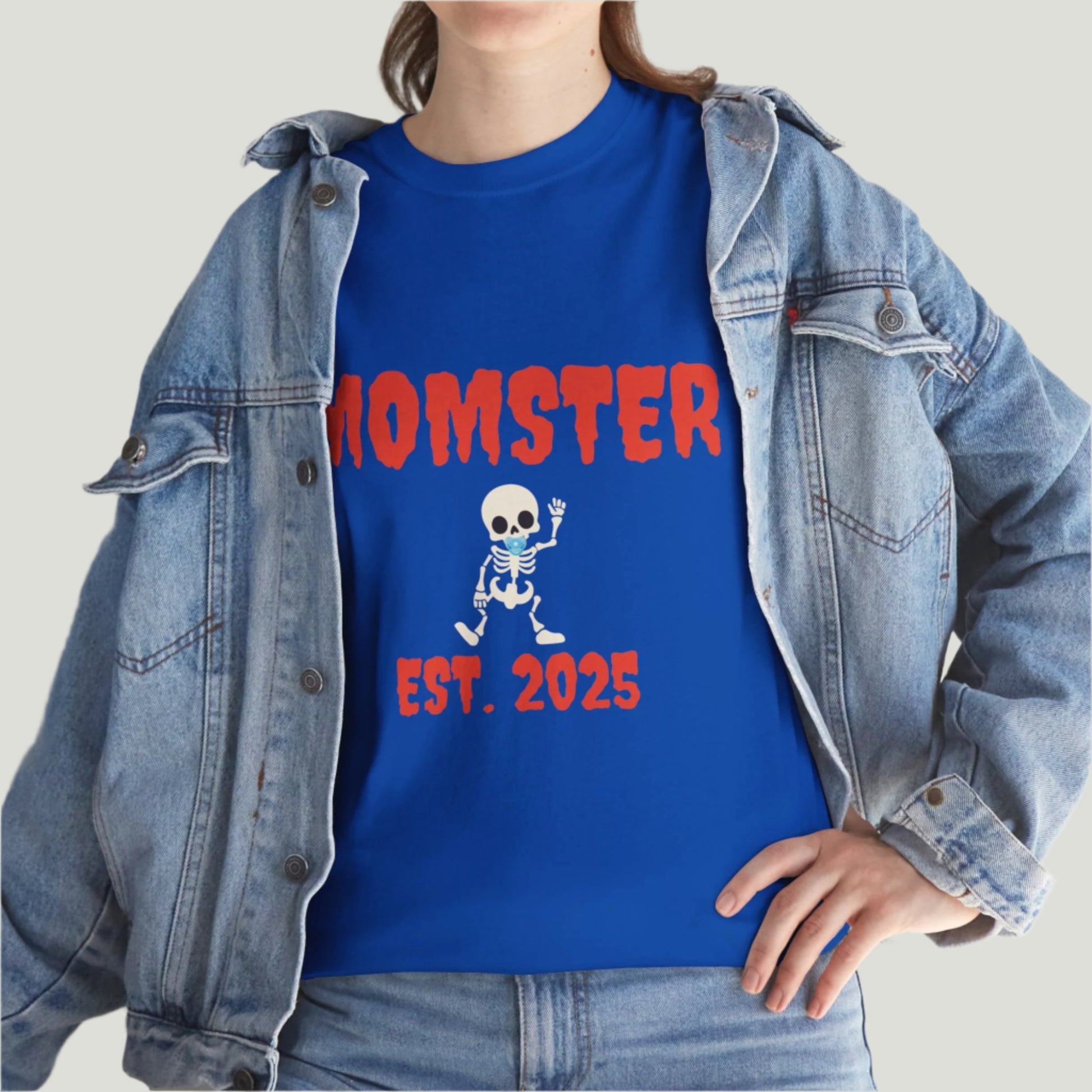 Neon blue t-shirt featuring red text "Momster Est. 2025," perfect for announcing a pregnancy during Halloween, showcasing a playful and festive design.