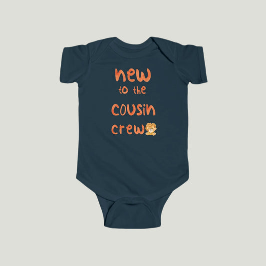 Navy baby onesie featuring orange text that reads "New to the Cousin Crew," perfect for announcing a pregnancy to family and friends