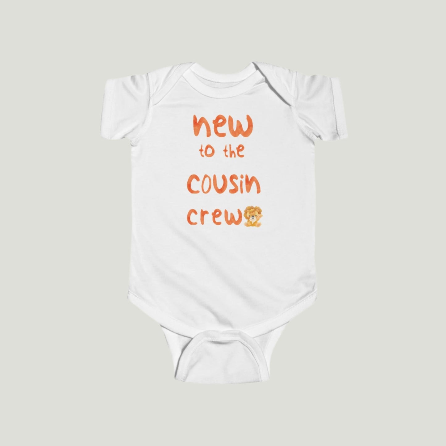 White baby onesie featuring orange text that reads "New to the Cousin Crew," perfect for announcing a pregnancy to family and friends